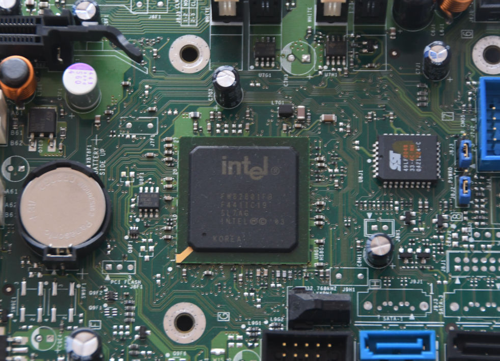 A close-up of a motherboard, focusing on the chip.